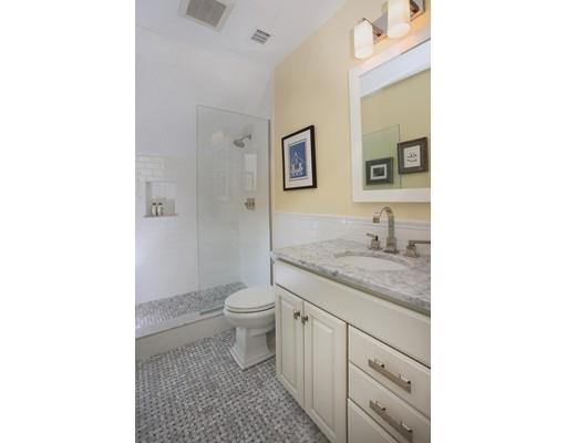 33 Kingsbury Road Newton, MA 02467 - Photo 15 of 23 a bathroom with a granite countertop toilet and sink