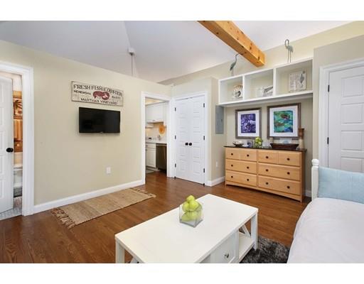 33 Kingsbury Road Newton, MA 02467 - Photo 19 of 23 a living room with furniture and a flat screen tv