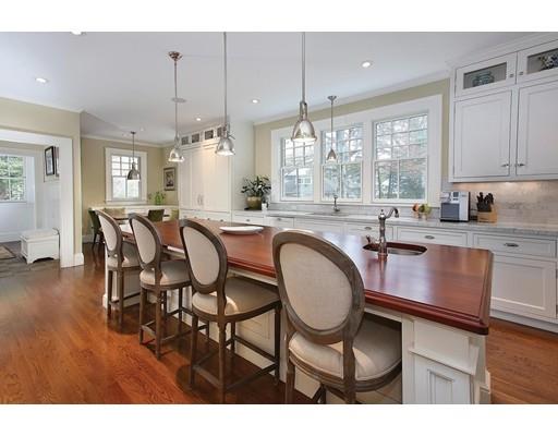 33 Kingsbury Road Newton, MA 02467 - Photo 6 of 23 a kitchen with sink dining table and chairs