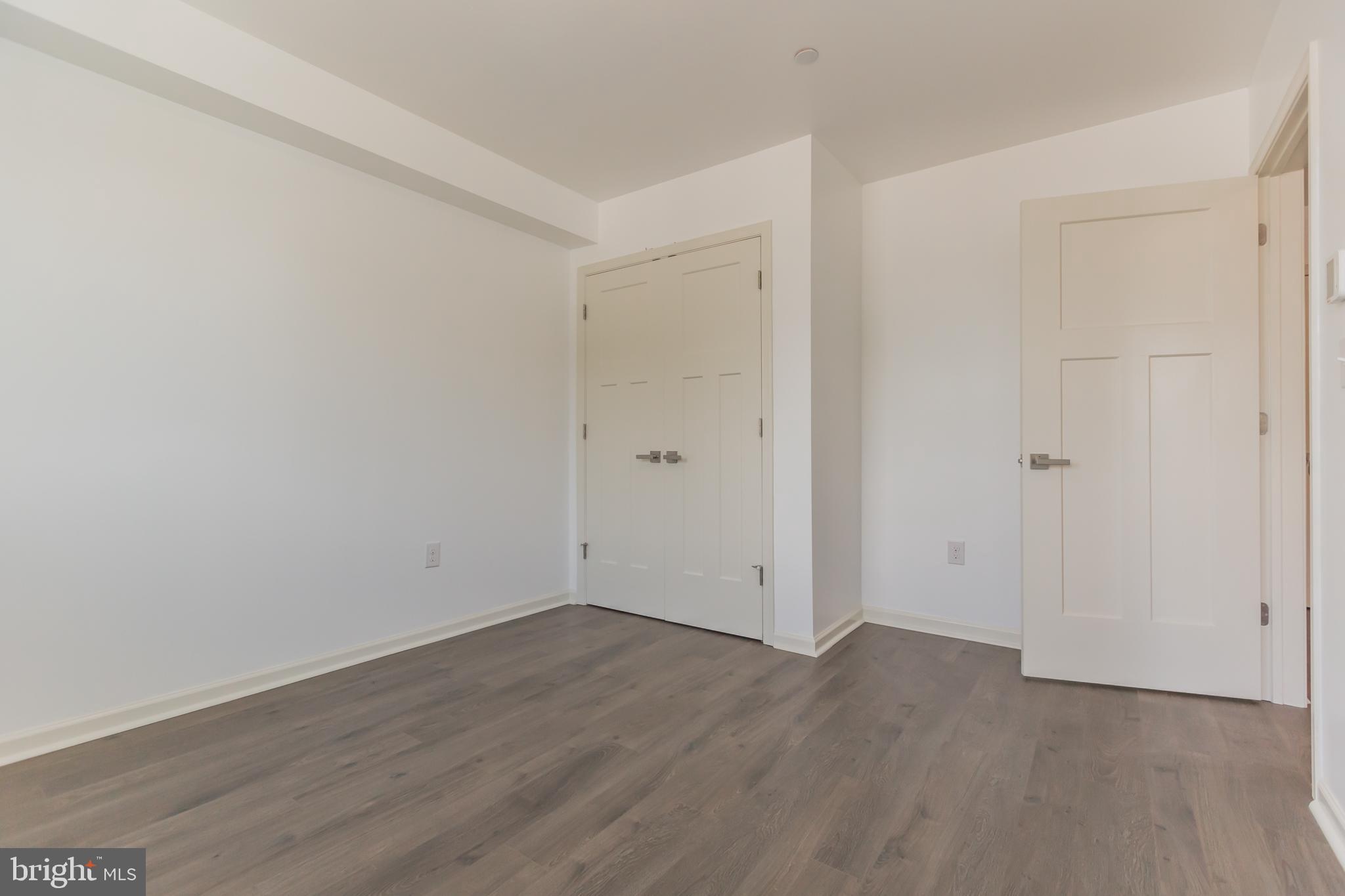 6778 Ridge Avenue, Unit 403 Philadelphia, PA 19128 - Photo 9 of 11 a view of room with wooden floor