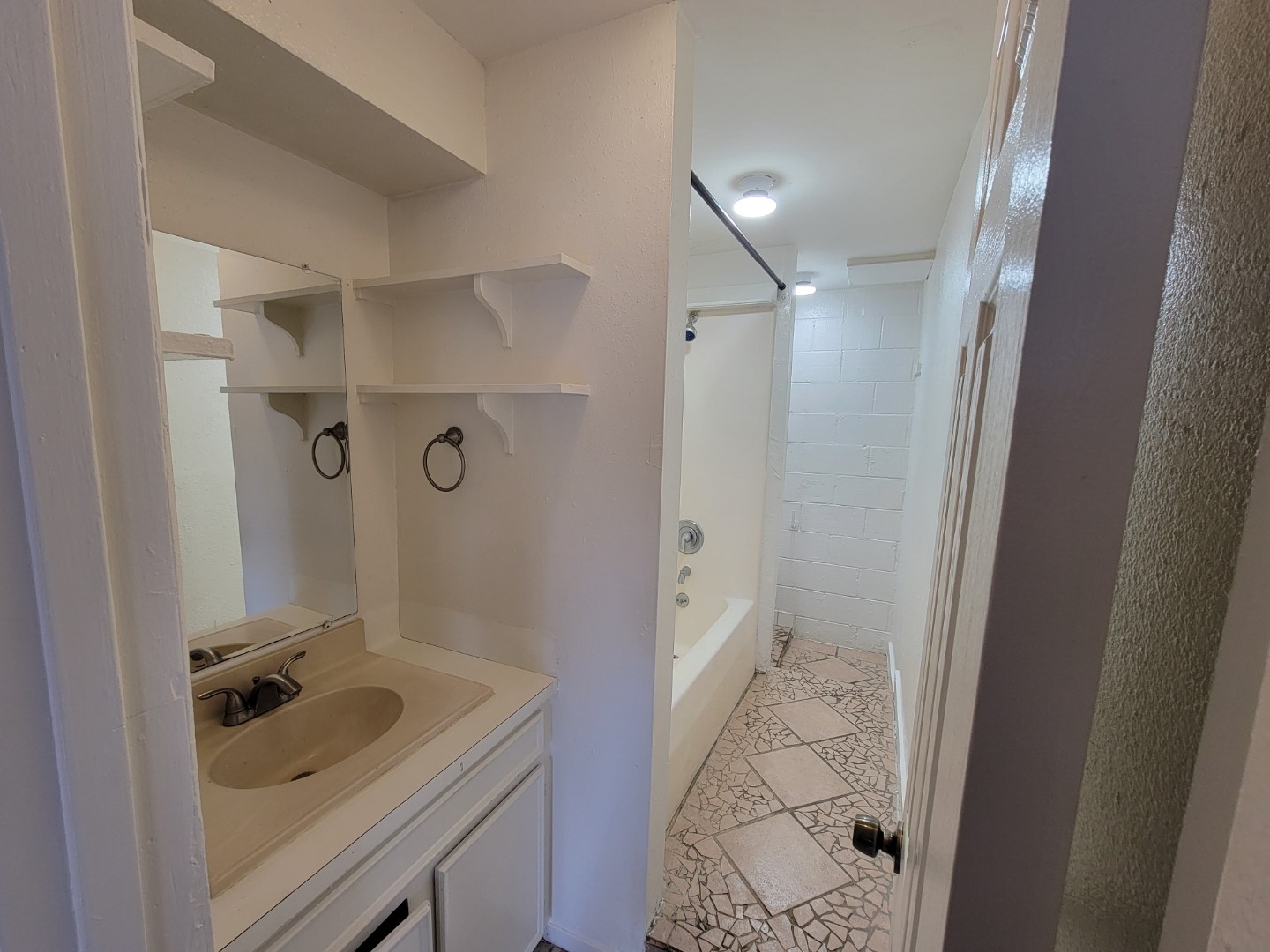 7124 Avenue I, Unit 2 Houston, TX 77011 - Photo 4 of 6 a bathroom with a sink a toilet and shower