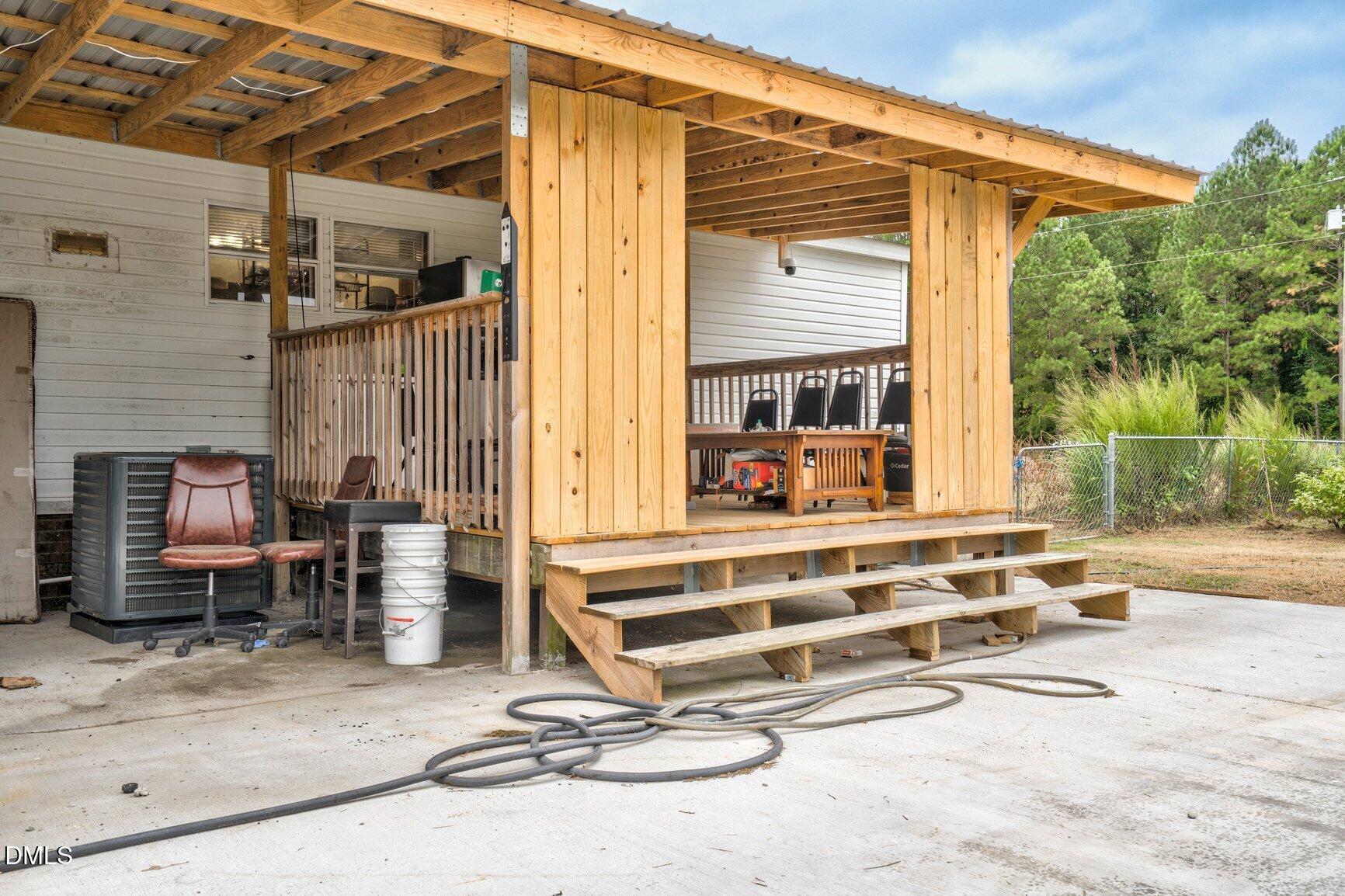1835 Cokey Road Rocky Mount, NC 27801 - Photo 26 of 42 a view of a dinning room with furniture and a backyard