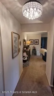 a view of a livingroom with furniture and a fan