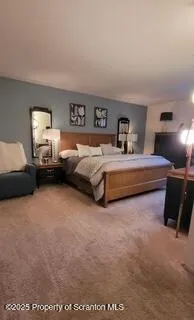 a spacious bedroom with a bed and window