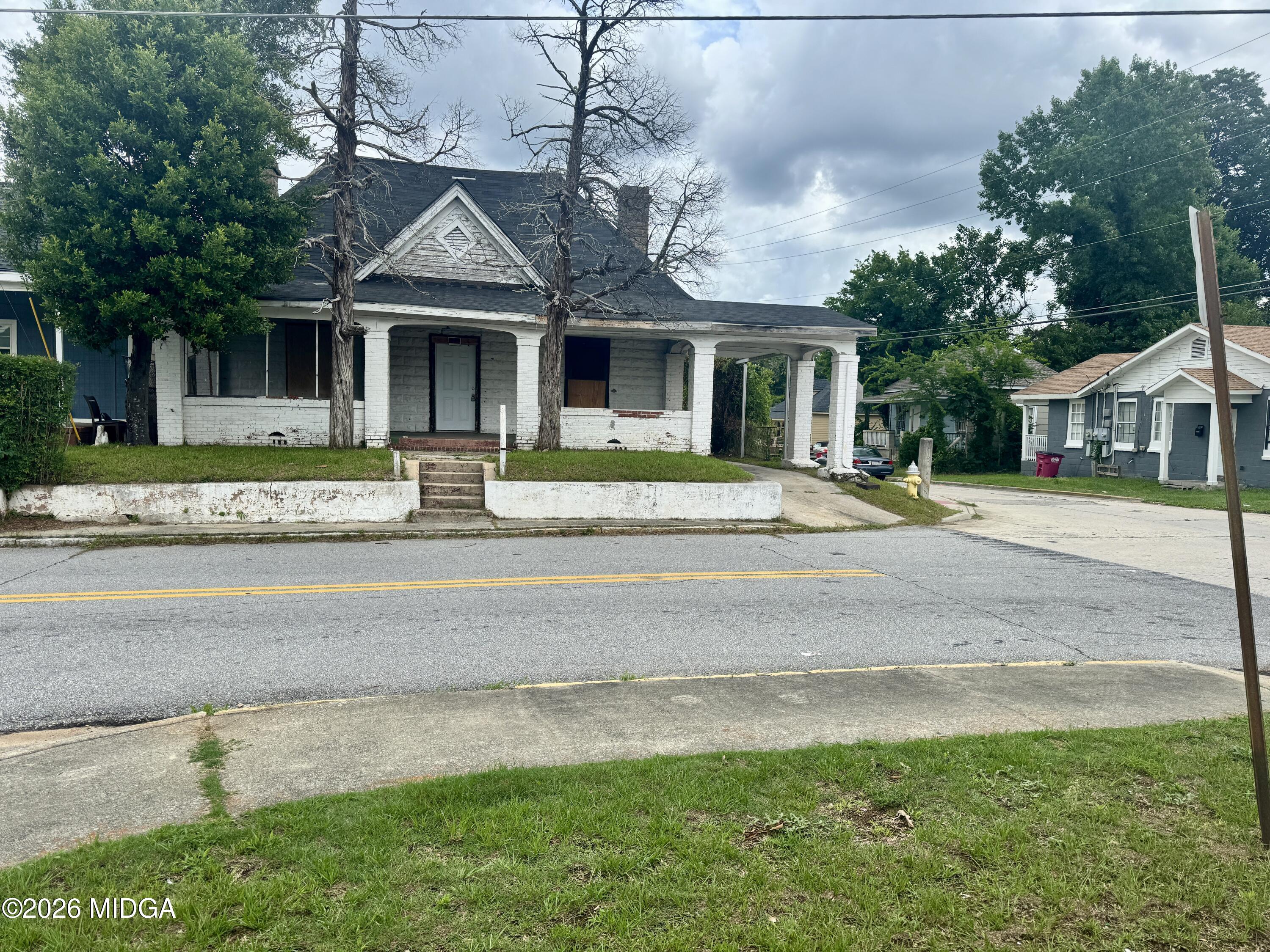1905 3rd Avenue Macon, GA 31201 - Photo 20 of 27 a front view of a house with a yard