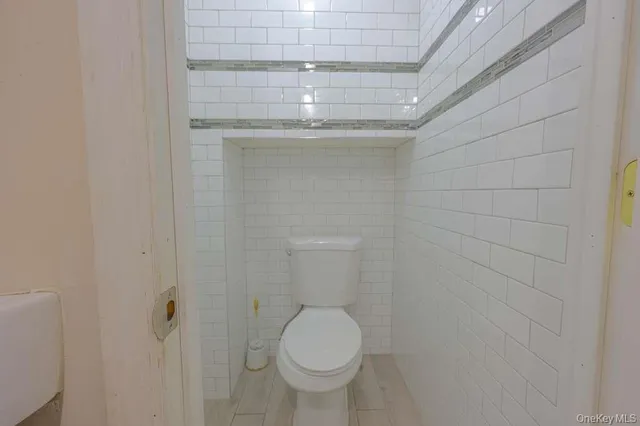 a bathroom with a toilet and a sink