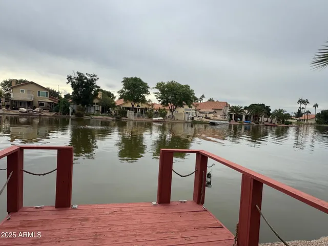 a view of a house with a wooden deck