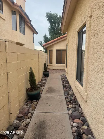 a view of a backyard with sitting area