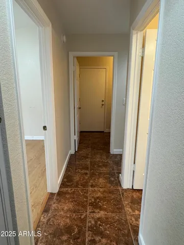 an empty room with wooden floor