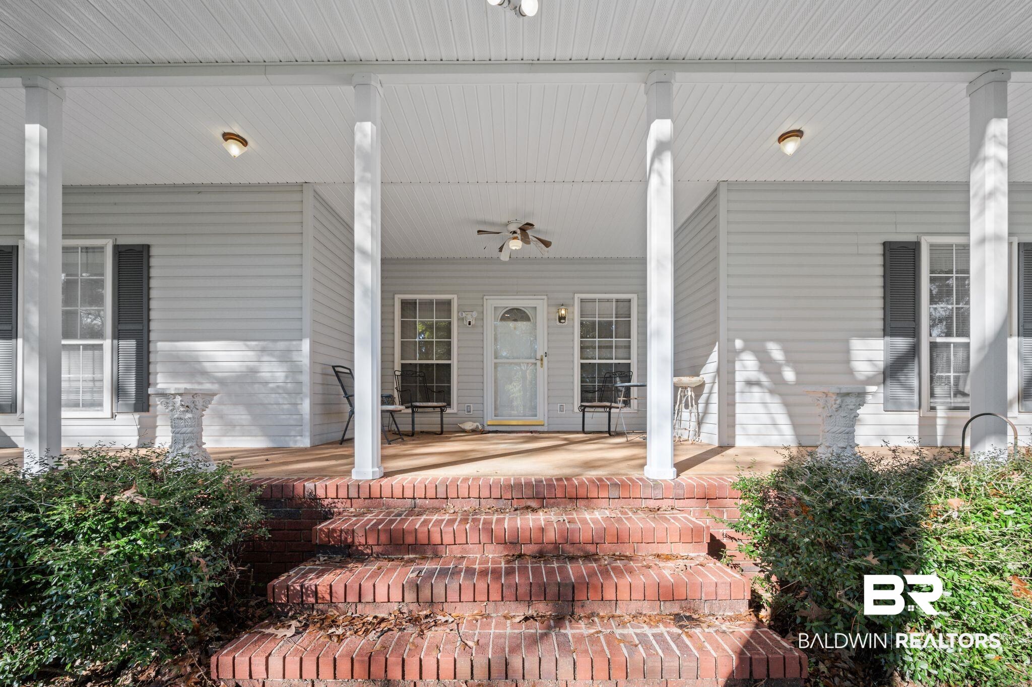 15801 Maytower Road Bay Minette, AL 36507 - Photo 4 of 43 Doorway to property featuring a porch and ceiling fan