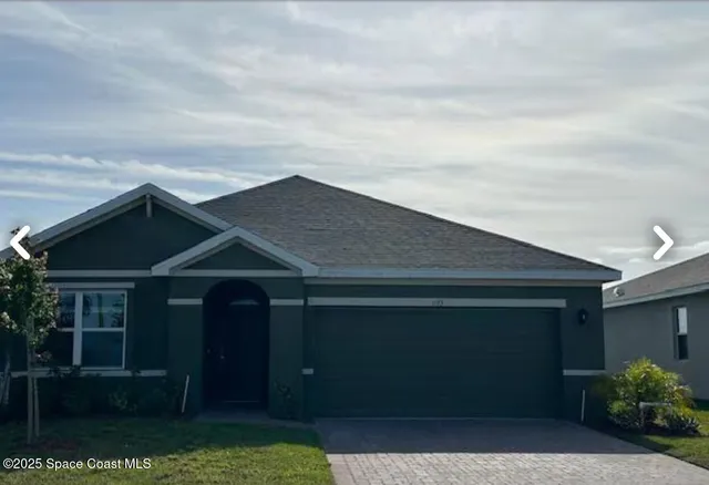 front view of a house with yard