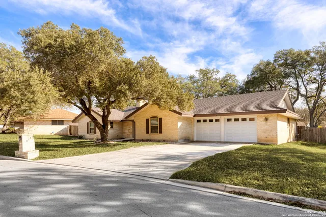 a view of house with a garden