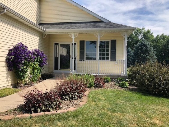 8708 South Rood Road Kingston, IL 60145 - Photo 14 of 15 a front view of a house with garden