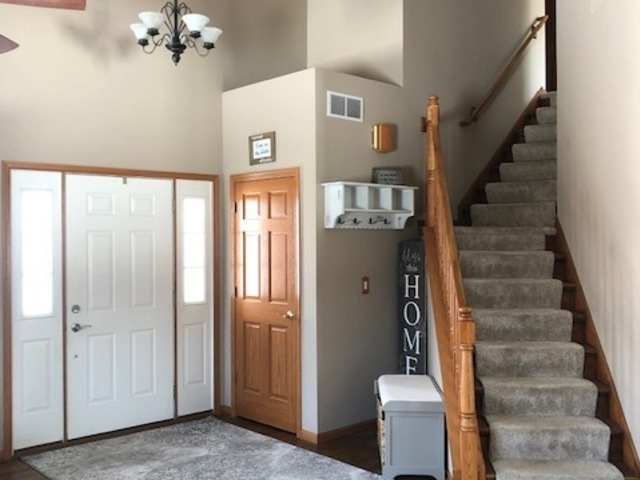 8708 South Rood Road Kingston, IL 60145 - Photo 6 of 15 a view of an entryway with staircase