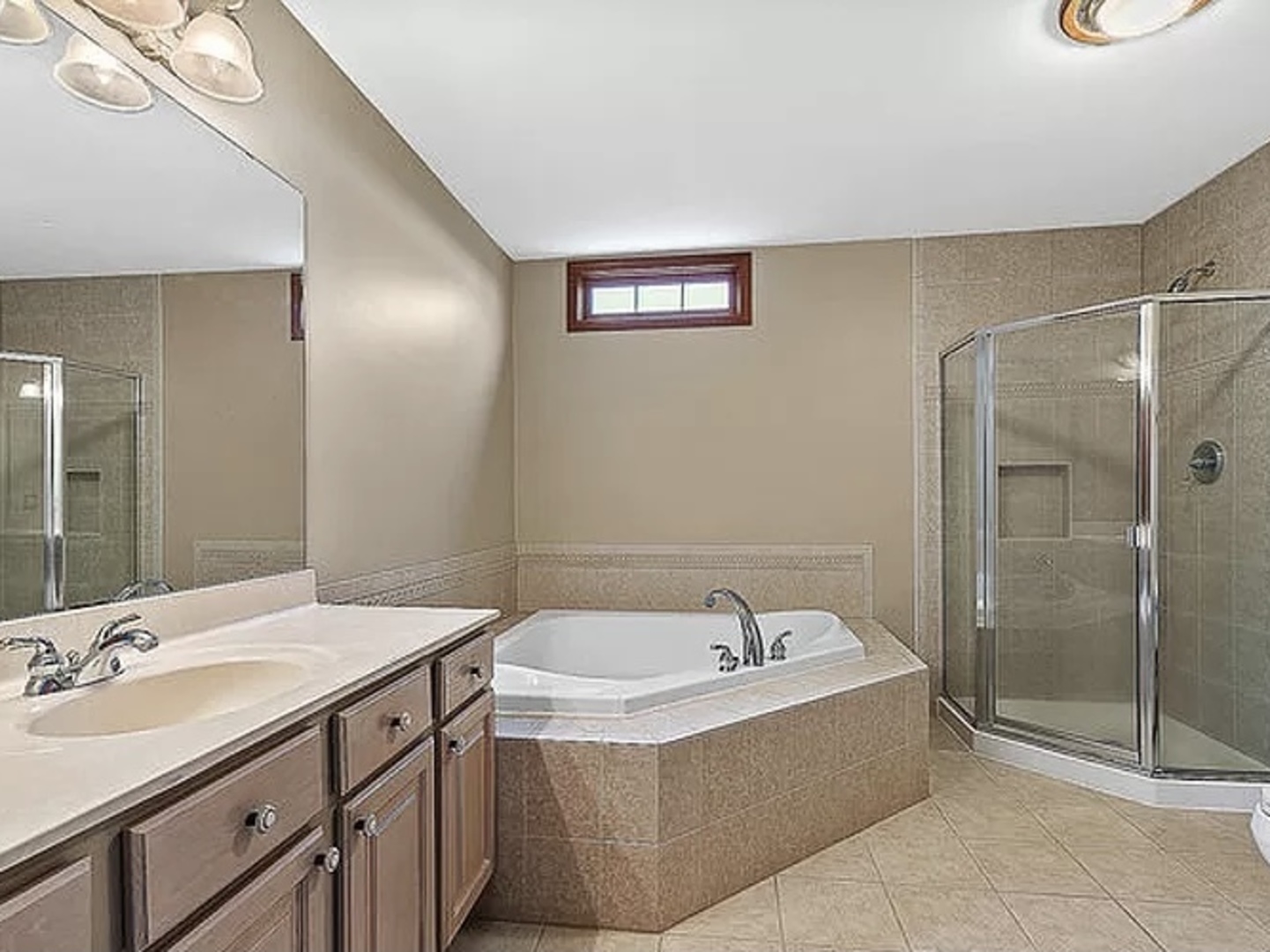 8708 South Rood Road Kingston, IL 60145 - Photo 10 of 15 a bathroom with a tub sink and mirror