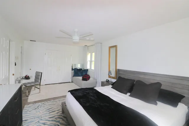 a bed room with a bed and furniture