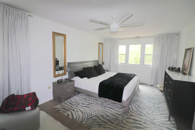 a bedroom with a bed and a couch