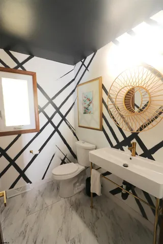 a bathroom with a sink and mirror