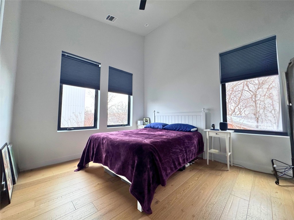 1206 Luna Street, Unit 2 Austin, TX 78721 - Photo 16 of 20 a bed sitting in a bedroom next to a window