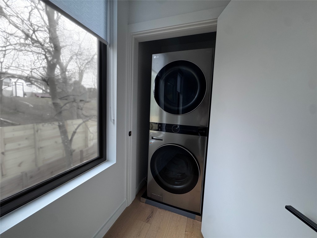 1206 Luna Street, Unit 2 Austin, TX 78721 - Photo 19 of 20 a view of a hallway with washer and dryer