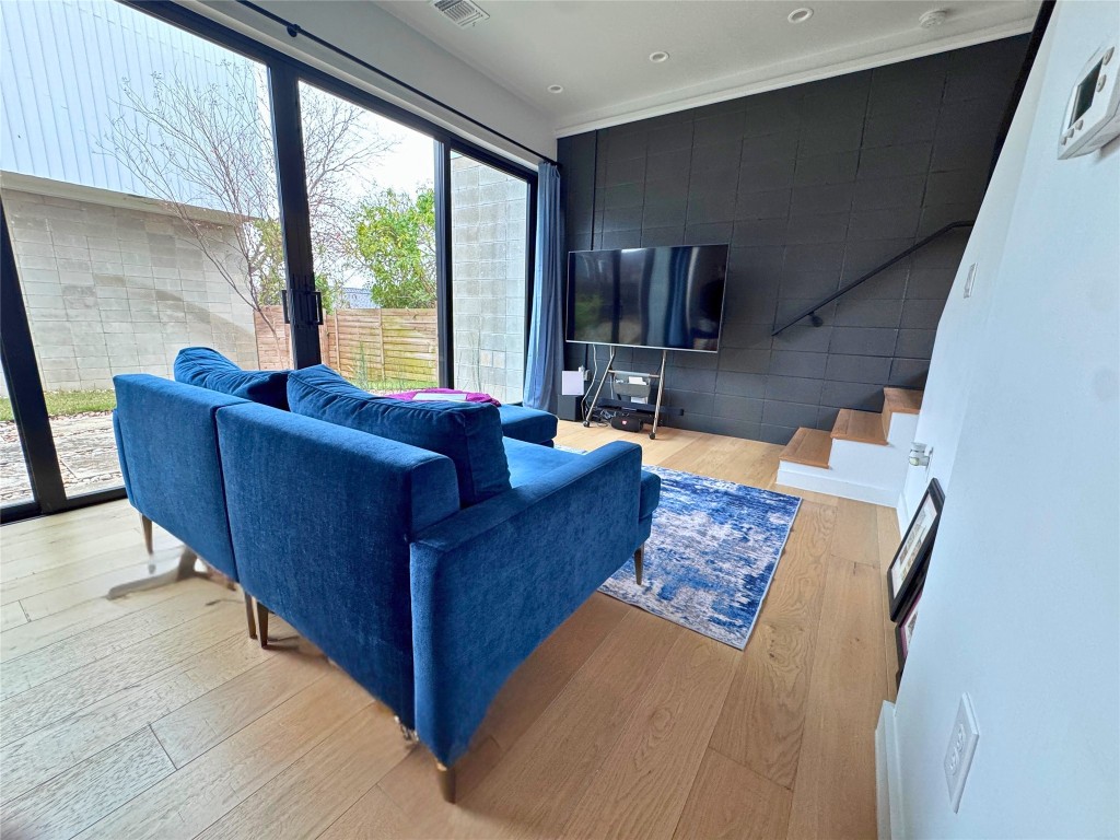 1206 Luna Street, Unit 2 Austin, TX 78721 - Photo 8 of 20 a living room with furniture and a large window