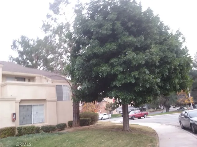 a view of street with parked cars