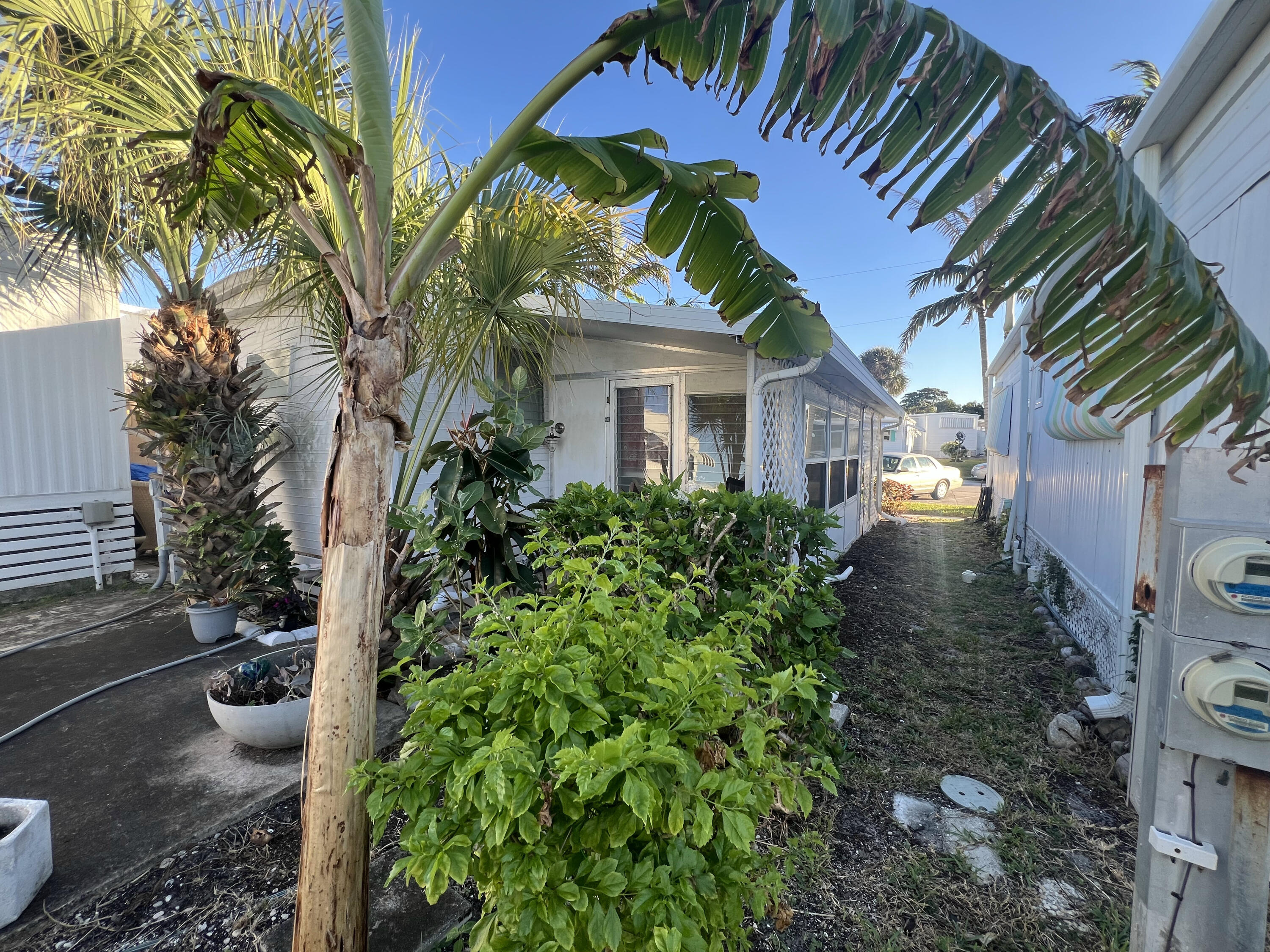 21 Ruthmary Avenue, Unit G Briny Breezes, FL 33435 - Photo 6 of 11 a front view of a house with a yard