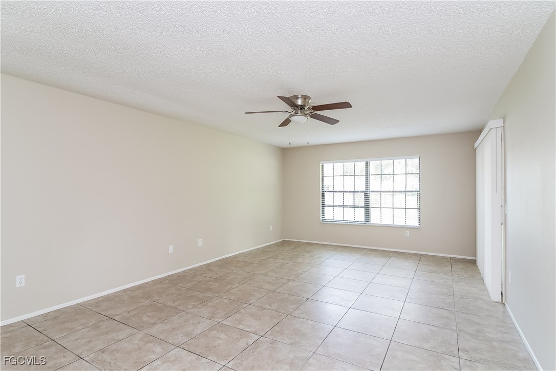 2802 31st Street Southwest Lehigh Acres, FL 33976 - Photo 4 of 16 a view of an empty room and window