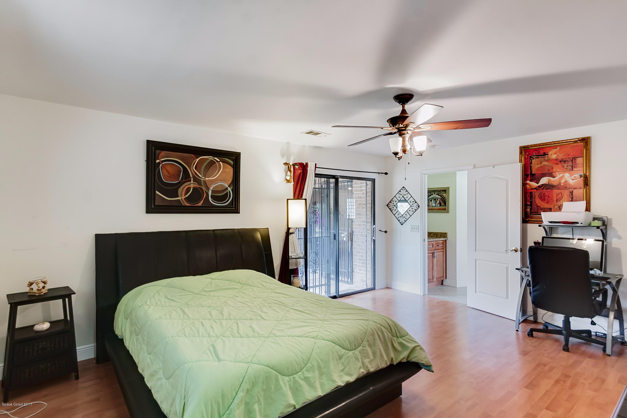 2838 Kosuth Road Northeast Palm Bay, FL 32905 - Photo 11 of 27 Master Bedroom with Personal Slider