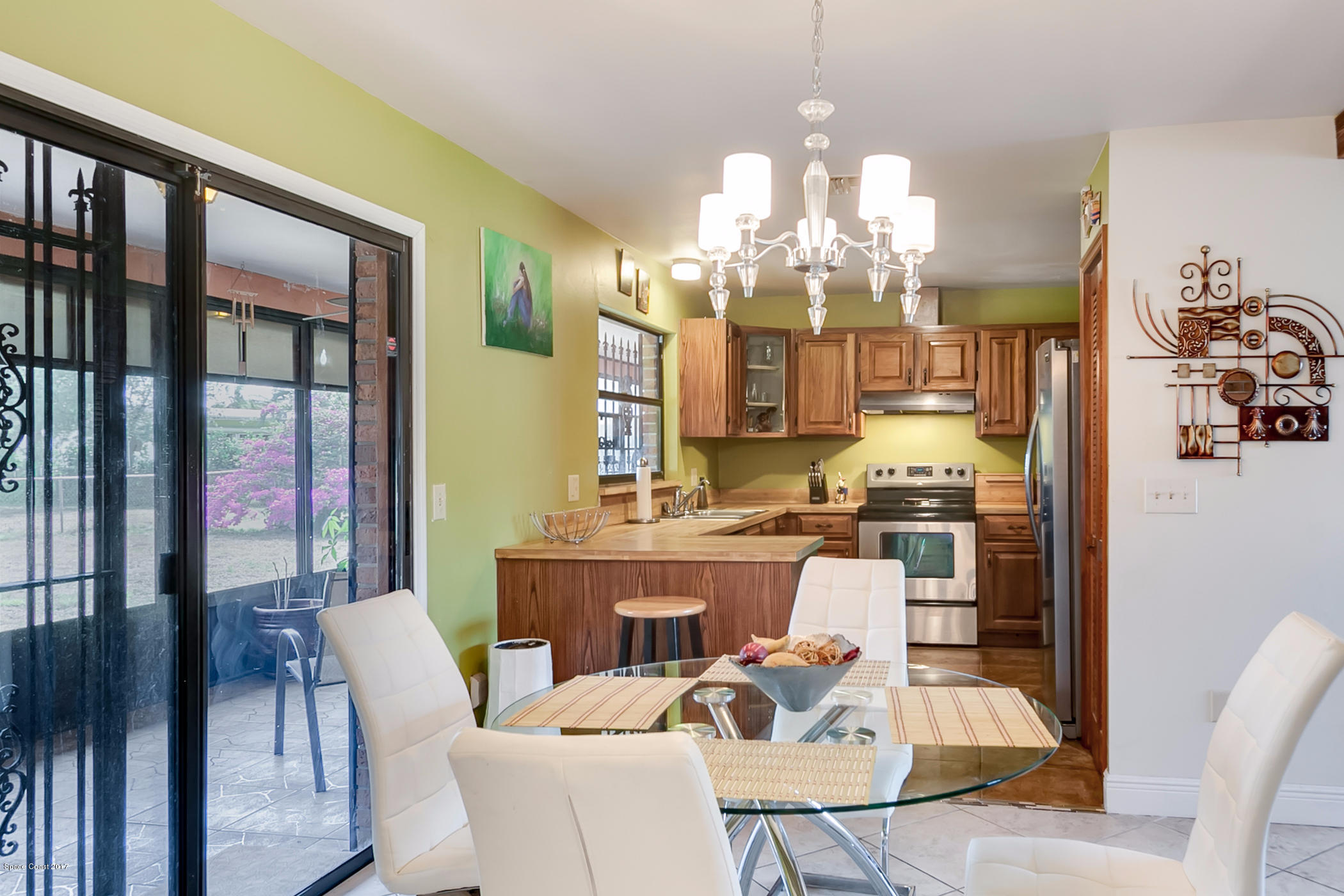 2838 Kosuth Road Northeast Palm Bay, FL 32905 - Photo 17 of 27 Dining Room Looking Into Kitchen