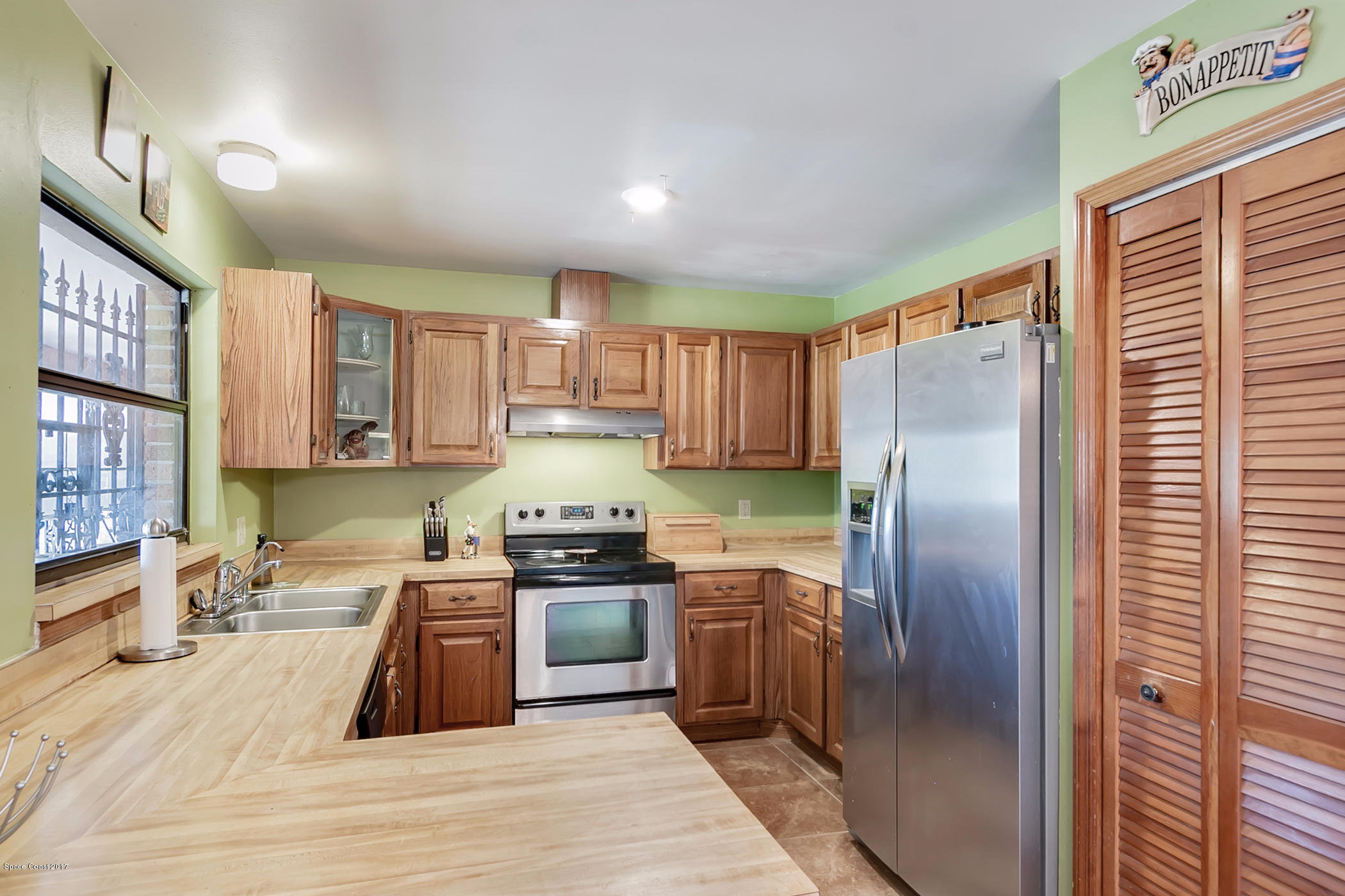 2838 Kosuth Road Northeast Palm Bay, FL 32905 - Photo 18 of 27 Kitchen with Stainless Steel Appliances