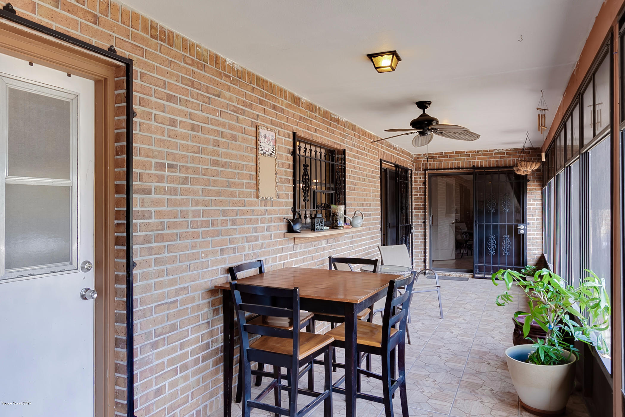 2838 Kosuth Road Northeast Palm Bay, FL 32905 - Photo 25 of 27 Back Screen Porch with Bathroom Access