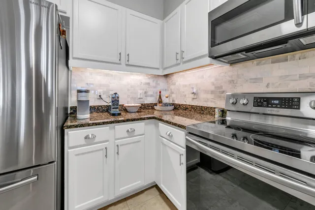 a kitchen with appliances cabinets and a counter top
