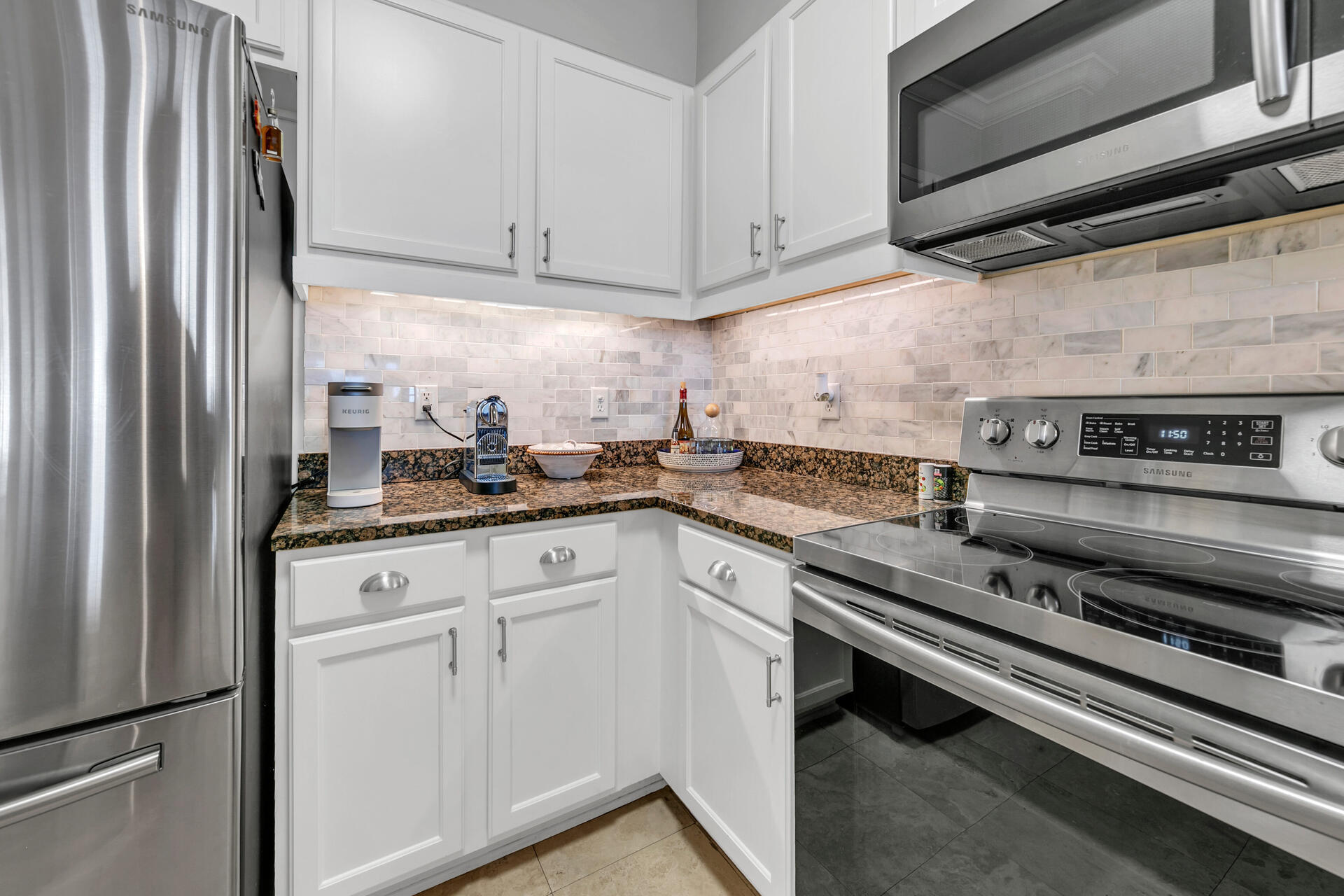 10343 East County Highway 30A, Unit 410 Inlet Beach, FL 32413 - Photo 12 of 32 a kitchen with appliances cabinets and a counter top