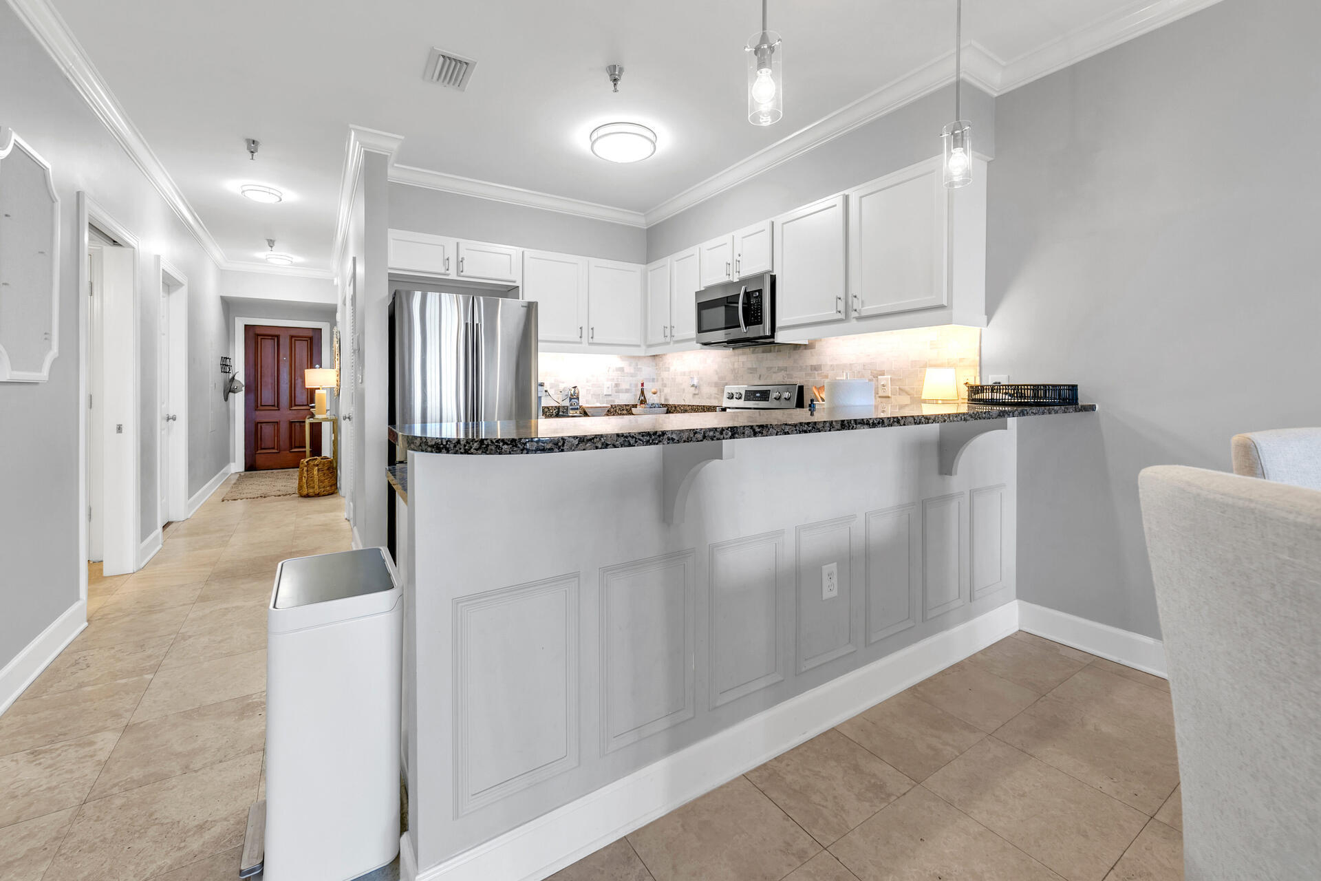 10343 East County Highway 30A, Unit 410 Inlet Beach, FL 32413 - Photo 14 of 32 a kitchen with stainless steel appliances granite countertop a refrigerator and a stove top oven