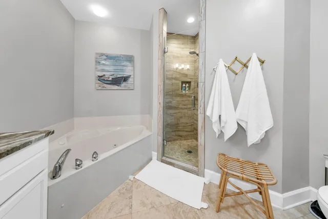 a bathroom with a bathtub and shower
