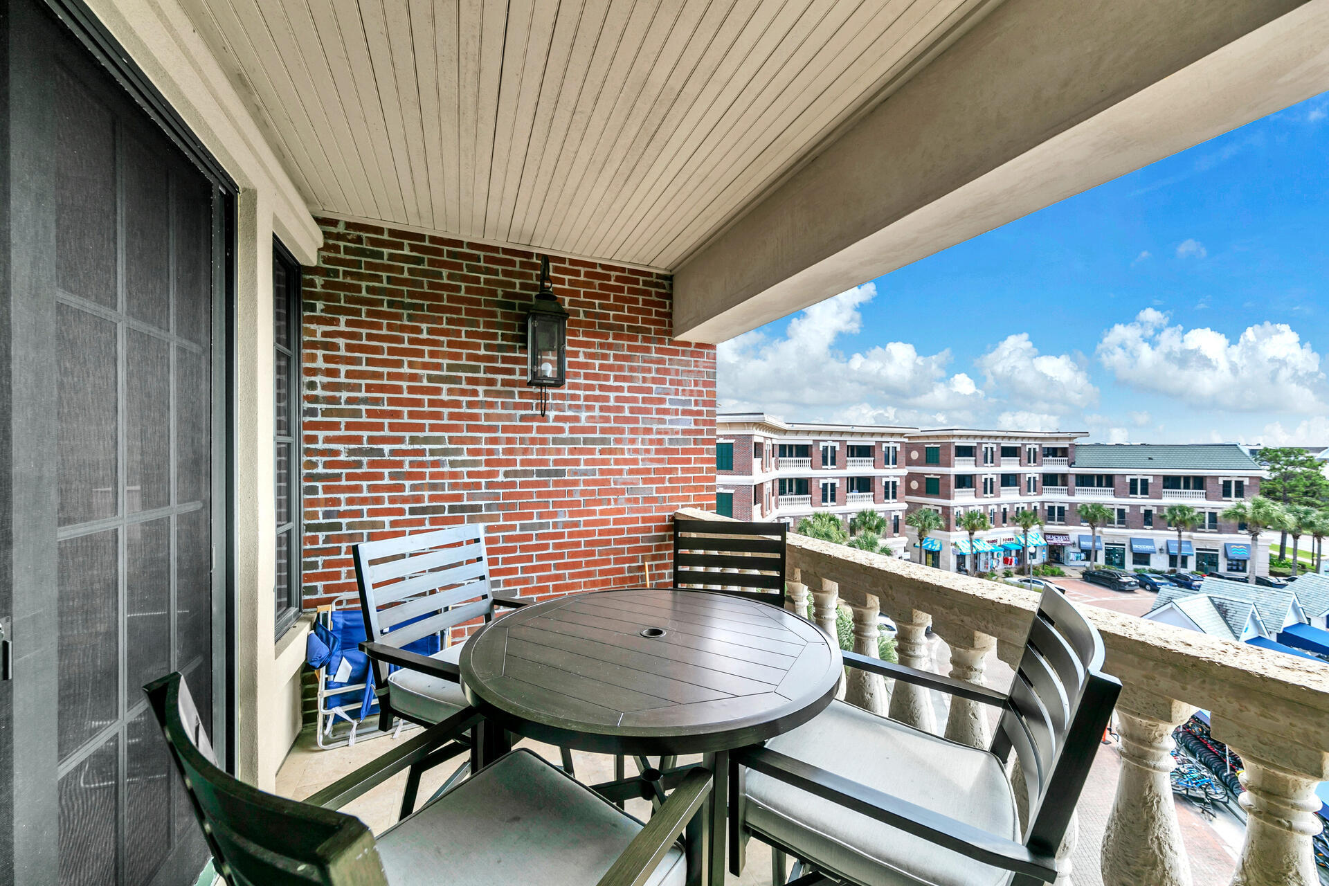 10343 East County Highway 30A, Unit 410 Inlet Beach, FL 32413 - Photo 29 of 32 a balcony with a table and chairs