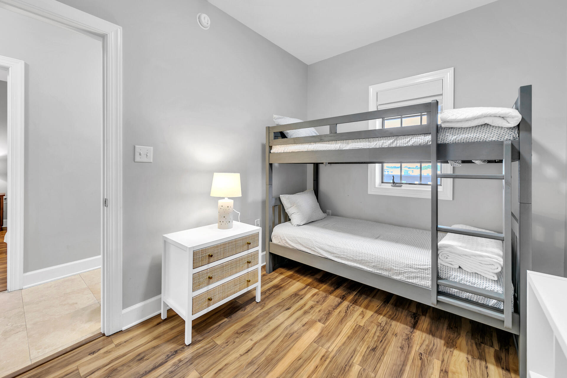 10343 East County Highway 30A, Unit 410 Inlet Beach, FL 32413 - Photo 4 of 32 a bedroom with a bed and wooden floor