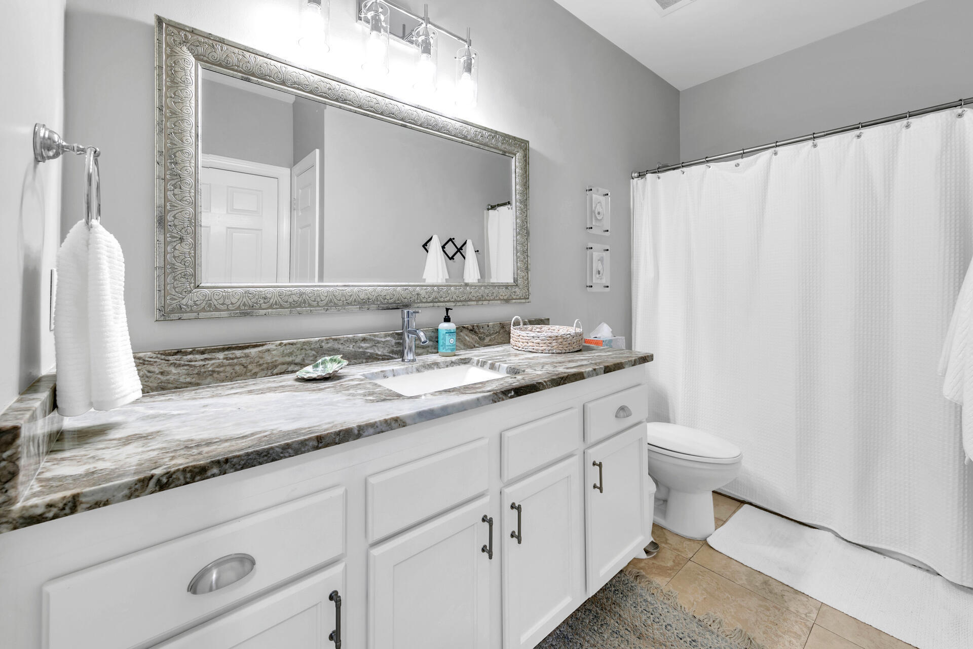 10343 East County Highway 30A, Unit 410 Inlet Beach, FL 32413 - Photo 9 of 32 a bathroom with a granite countertop sink and a mirror