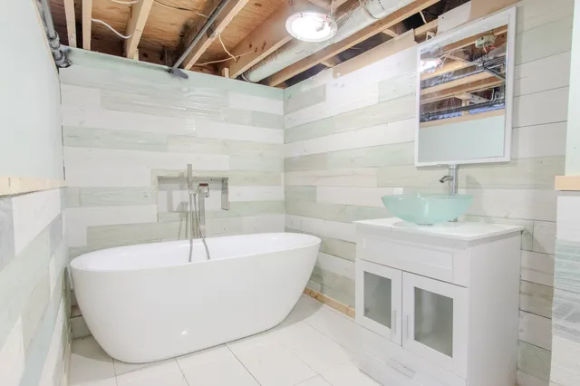 a white bath tub sitting in a bathroom