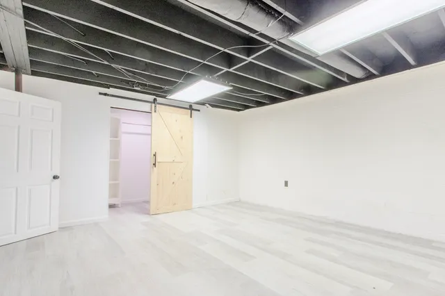 a black and white photo of a refrigerator