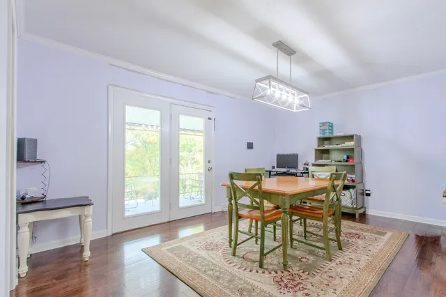 a kitchen with stainless steel appliances granite countertop a sink stove microwave and refrigerator