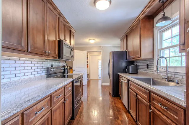 a bedroom with a bed and a ceiling fan