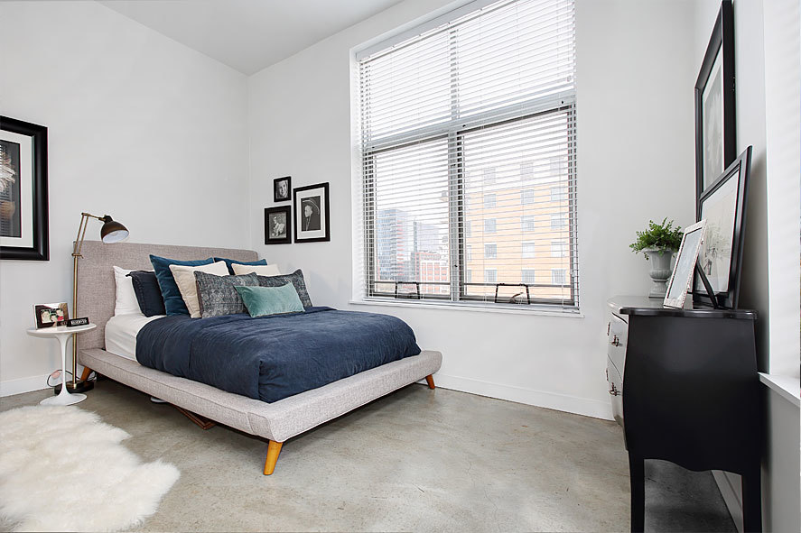 939 West Madison Street, Unit 510 Chicago, IL 60607 - Photo 12 of 13 a living room with a bed furniture and a window