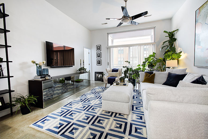 939 West Madison Street, Unit 510 Chicago, IL 60607 - Photo 4 of 13 a living room with furniture and a flat screen tv