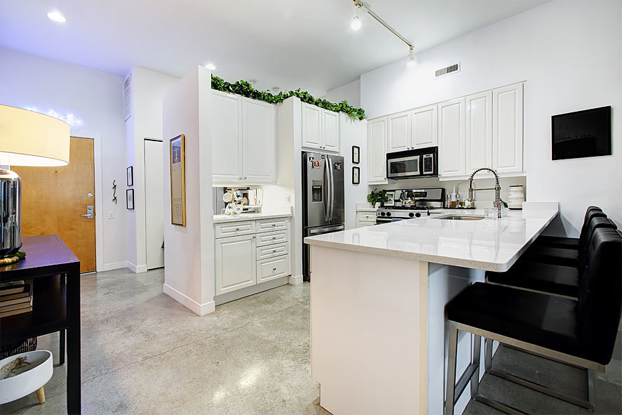 939 West Madison Street, Unit 510 Chicago, IL 60607 - Photo 6 of 13 a kitchen with stainless steel appliances a stove refrigerator sink and microwave