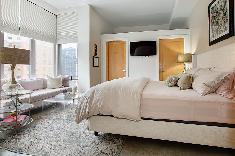 939 West Madison Street, Unit 510 Chicago, IL 60607 - Photo 10 of 13 a bedroom with a large bed and a flat tv screen on dresser