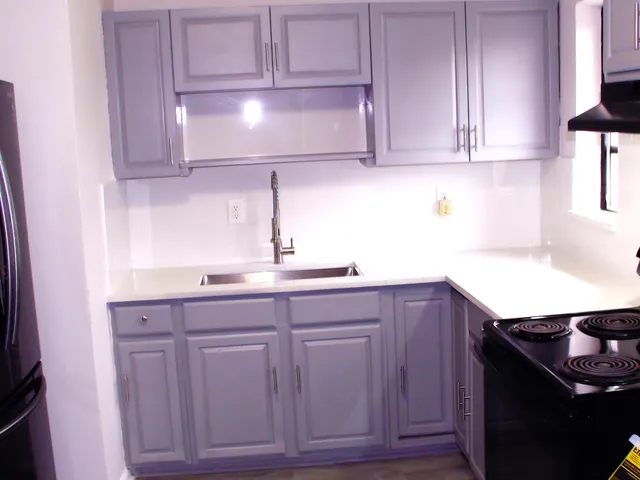 a kitchen with cabinets and a sink