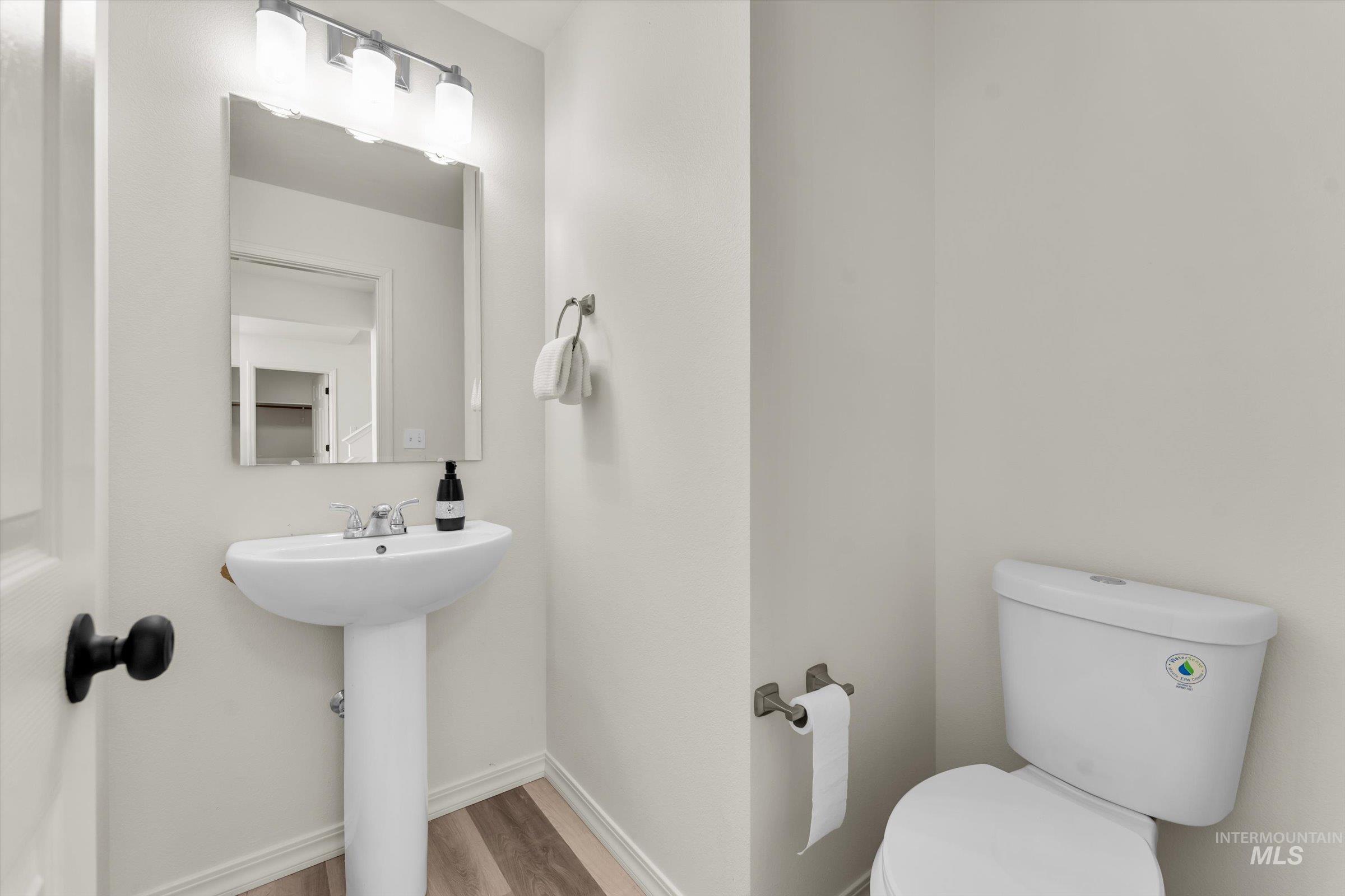5602 Barkley Way Caldwell, ID 83607 - Photo 13 of 36 Bathroom with toilet and light wood-style flooring