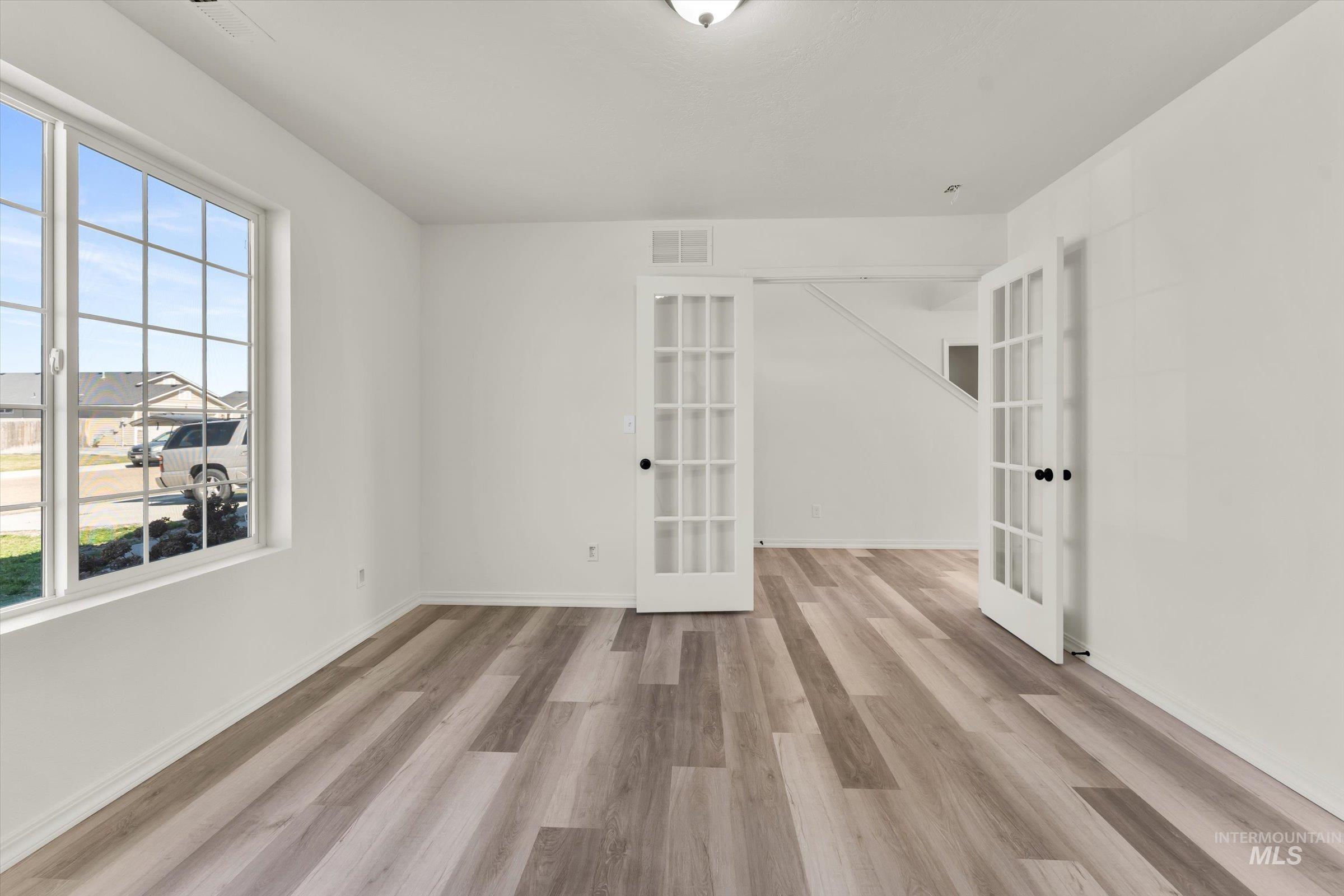5602 Barkley Way Caldwell, ID 83607 - Photo 22 of 36 Spare room with light wood-style floors and french doors